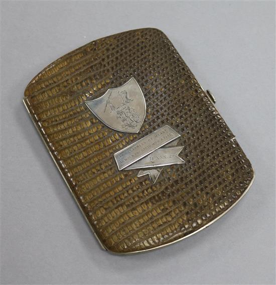 An animal skin wallet with engraved white metal appliques, 14.7cm.